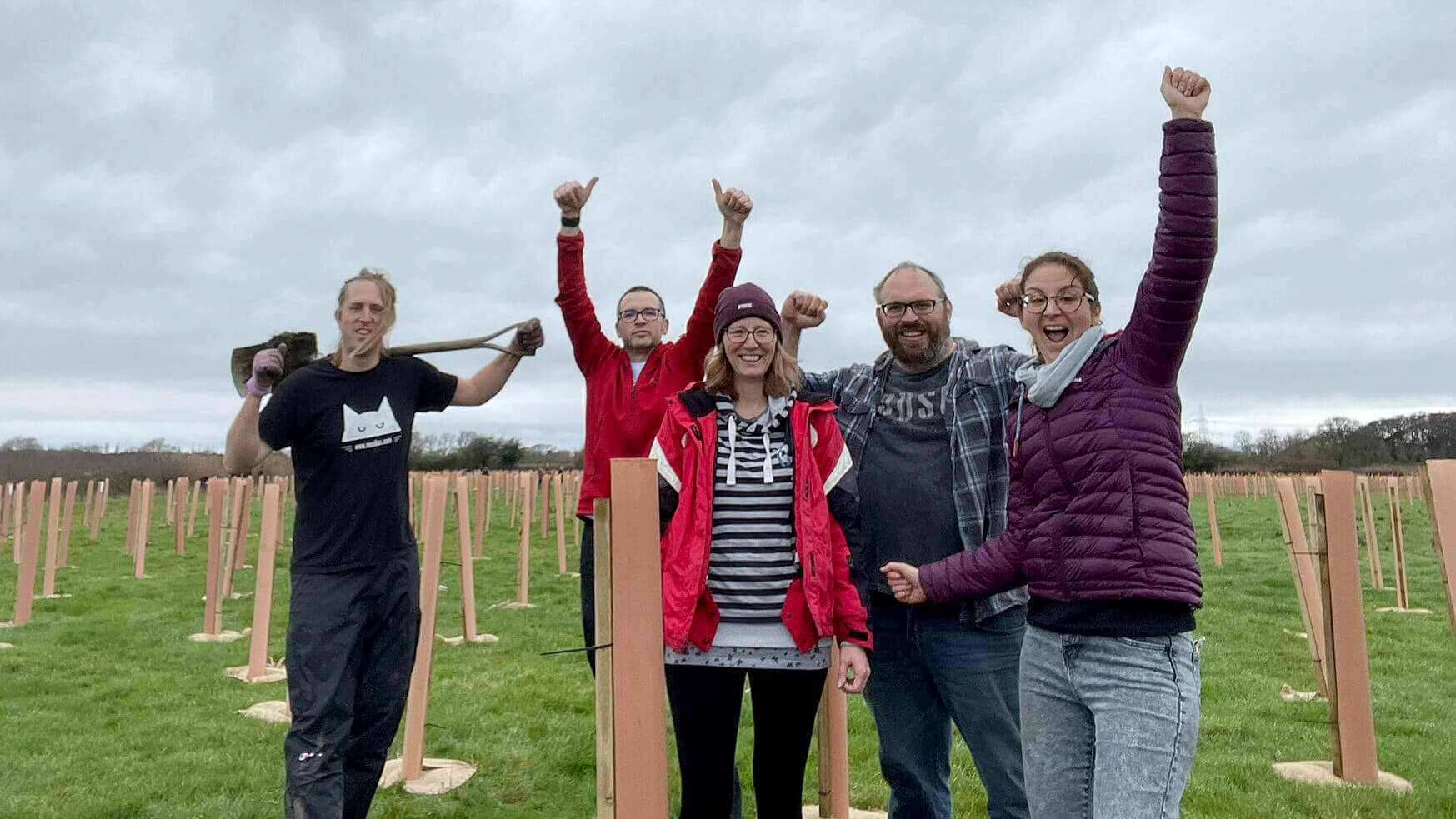 Darren McGrath, Nathan Baranowski, Rachel Passmore, Tom Passmore and Kim Hannon cheering from finishing their tree planting