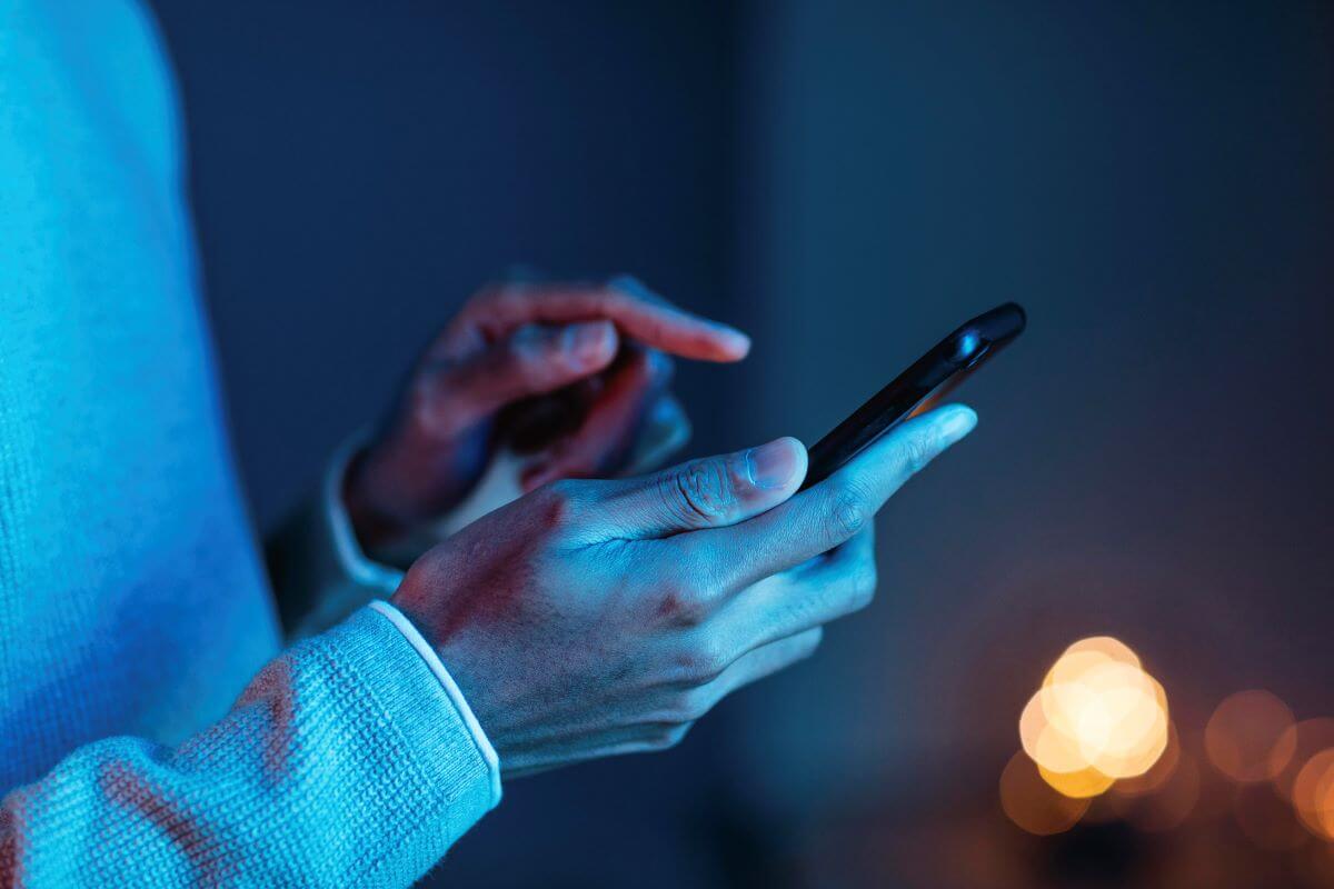 Side View Man Using Smartphone 