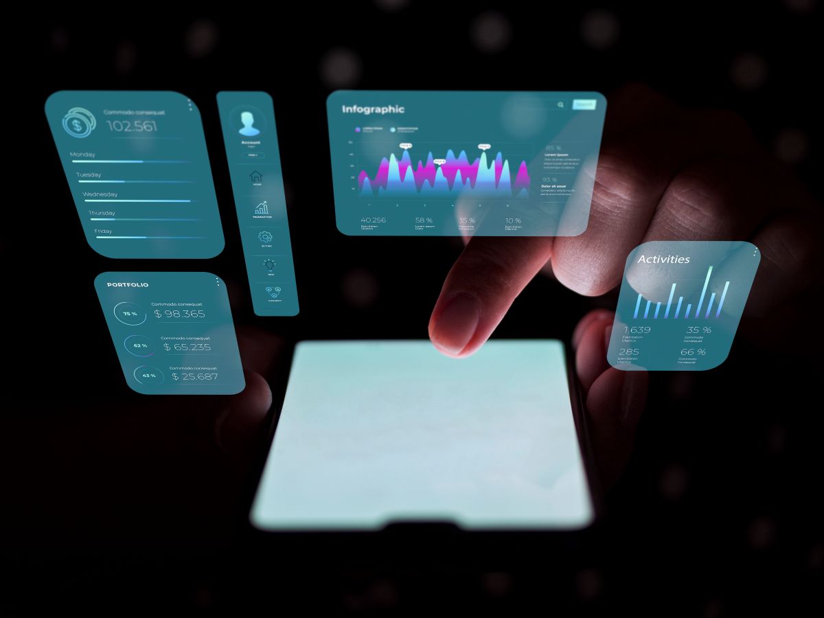Mobile device with illuminated graphs and data above, representing tools for gathering UX data
